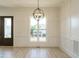 Bright living space featuring white trim, beautiful windows and luxury vinyl plank flooring at 142 Batten Hill Ln, Selma, NC 27576
