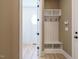 Mudroom features a built-in bench with coat hooks and storage shelves at 142 Batten Hill Ln, Selma, NC 27576