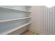 Pantry features spacious shelving and wooden floors at 142 Batten Hill Ln, Selma, NC 27576