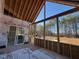 The unfinished porch, with framing completed, offers a view of the lot beyond at 142 Batten Hill Ln, Selma, NC 27576