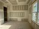 Sunlit room with a large window, ready for your personalized touch and unique style at 142 Batten Hill Ln, Selma, NC 27576