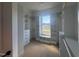 Well-organized walk-in closet with built-in shelving, drawers, and a window seat at 142 Batten Hill Ln, Selma, NC 27576