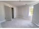 A bedroom with trim, baseboards, and a window for natural light is ready for finishes at 1901 Old Bramble Ln # 3, Fuquay Varina, NC 27526