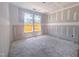 A bedroom is under construction, featuring drywall, unfinished floors, and large windows with natural light at 1901 Old Bramble Ln # 3, Fuquay Varina, NC 27526