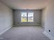 Bedroom with big windows providing great neighborhood views and ample natural light at 1901 Old Bramble Ln # 3, Fuquay Varina, NC 27526