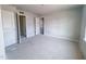 Bright bedroom featuring large windows and an open doorway at 1901 Old Bramble Ln # 3, Fuquay Varina, NC 27526