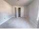 A bedroom with trim and a closet for storage ready for new finishes at 1901 Old Bramble Ln # 3, Fuquay Varina, NC 27526