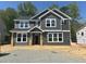 Two-story home featuring gray siding, white trim, and a covered front porch at 1901 Old Bramble Ln # 3, Fuquay Varina, NC 27526