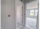 Hallway featuring natural light and views into a bedroom with a window at 1901 Old Bramble Ln # 3, Fuquay Varina, NC 27526