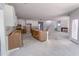 Expansive kitchen area with modern white cabinets and an island, flowing into a connected living area at 1901 Old Bramble Ln # 3, Fuquay Varina, NC 27526