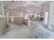 Expansive living room area with open floor plan, stairs, and large windows at 1901 Old Bramble Ln # 3, Fuquay Varina, NC 27526