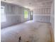 A spacious living room featuring large windows and ample natural light at 1901 Old Bramble Ln # 3, Fuquay Varina, NC 27526