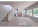 Spacious living room features a fireplace, staircase and generous natural light at 1901 Old Bramble Ln # 3, Fuquay Varina, NC 27526
