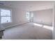 Sunlit living room showcasing large windows and neutral walls, awaiting personalization at 1901 Old Bramble Ln # 3, Fuquay Varina, NC 27526