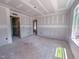 Unfinished living room showcasing ample natural light from a window during construction at 1901 Old Bramble Ln # 3, Fuquay Varina, NC 27526