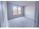 Well-lit room with a large window, ready for personalization at 1901 Old Bramble Ln # 3, Fuquay Varina, NC 27526