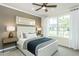 Comfortable bedroom with a ceiling fan, neutral tones, and bright natural light at 2330 Del Webb Gardens Dr, Fuquay Varina, NC 27526