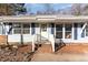 Charming house with blue siding, white trim, and inviting brick steps at 3015 E Brinkley Dr, Spring Lake, NC 28390