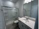 This clean bathroom offers a quartz countertop vanity and shower with glass door at 50 Calabria Ct, Franklinton, NC 27525