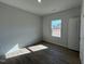 This bedroom has wood-look floors, great natural light, and neutral paint at 50 Calabria Ct, Franklinton, NC 27525