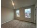 This carpeted bedroom has great natural light and a neutral color palette at 50 Calabria Ct, Franklinton, NC 27525