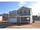 Two-story house with gray siding, white trim, and a two-car garage at 50 Calabria Ct, Franklinton, NC 27525