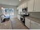 Modern kitchen with granite countertops and stainless steel appliances at 50 Calabria Ct, Franklinton, NC 27525