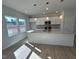 Modern kitchen with granite countertops and stainless steel appliances at 50 Calabria Ct, Franklinton, NC 27525