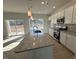 Kitchen features granite countertops, stainless steel appliances, and an island at 50 Calabria Ct, Franklinton, NC 27525