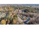 Neighborhood aerial view highlighting the townhouses surrounded by mature trees and landscaped areas at 526 Elm Ave, Wake Forest, NC 27587