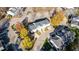 Aerial view of well-maintained townhouses nestled among autumn foliage and paved streets at 526 Elm Ave, Wake Forest, NC 27587