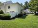 The townhome features a well-maintained backyard with lush green grass, offering a private outdoor space at 526 Elm Ave, Wake Forest, NC 27587