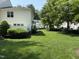 Lush green backyard providing a serene and private outdoor space at 526 Elm Ave, Wake Forest, NC 27587