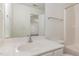 Bright bathroom featuring a large mirror, white vanity, and a shower/tub combo with modern fixtures at 526 Elm Ave, Wake Forest, NC 27587