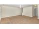 Large bedroom with carpet, ceiling fan and access to hallway at 526 Elm Ave, Wake Forest, NC 27587