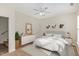 Bright bedroom featuring a ceiling fan, neutral decor, and ample closet space at 526 Elm Ave, Wake Forest, NC 27587