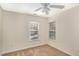 Bright bedroom with two windows offering natural light and cozy carpeting at 526 Elm Ave, Wake Forest, NC 27587