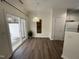 Dining room with hardwood floors, a sliding glass door to the patio, and a modern pendant light at 526 Elm Ave, Wake Forest, NC 27587