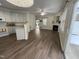 Open floor plan featuring a modern kitchen and living area with wood flooring and ample light at 526 Elm Ave, Wake Forest, NC 27587