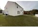 Spacious backyard with lush green lawn and a view of trees at 6 Heatherford Ct, Durham, NC 27704