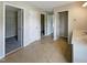 Bright bathroom featuring double sinks, tile floors, and multiple doors to closets or other rooms at 6 Heatherford Ct, Durham, NC 27704