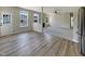 Open-concept living area with new flooring and great natural lighting at 6 Heatherford Ct, Durham, NC 27704