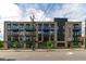 Modern building exterior featuring brick and sleek design elements against a bright blue sky at 615 W Peace St # 302, Raleigh, NC 27605