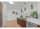 Open floor plan showcasing the kitchen featuring a central island at 615 W Peace St # 302, Raleigh, NC 27605