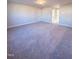 Large bedroom with carpet and access to hallway at 8817 Melvin St # 27, Willow Springs, NC 27592