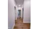 Clean hallway with light walls and hardwood floors at 8817 Melvin St # 27, Willow Springs, NC 27592