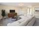 Relaxing living room, featuring sectional sofa and media console at 8817 Melvin St # 27, Willow Springs, NC 27592