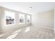 Bright bedroom with three windows and wall-to-wall carpet at 1815 Parham Dr, Graham, NC 27253