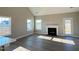 Spacious living room with fireplace and lots of natural light at 1815 Parham Dr, Graham, NC 27253