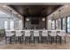 Stylish bar area with a sleek countertop, comfortable seating, and modern lighting at 1833 Hydrangea Way, Fuquay Varina, NC 27526